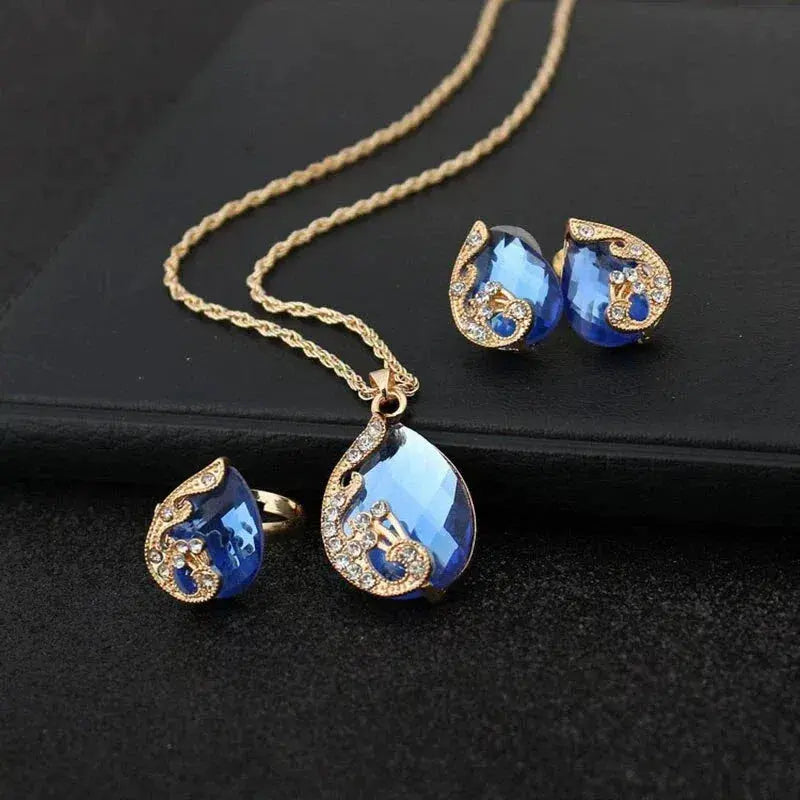 1+1 Offer: Blue Crystal Necklace + Earring Set in Blue Crystal in Gold